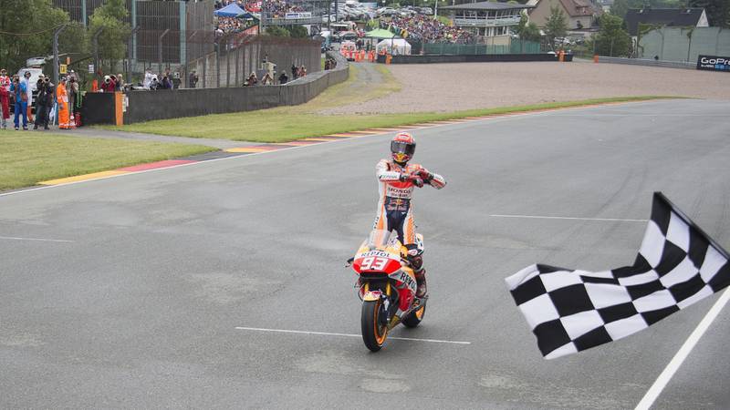 Marc Marquez celebrates victory in the 2016 MotoGP German Grand Prix at the Sachsenring